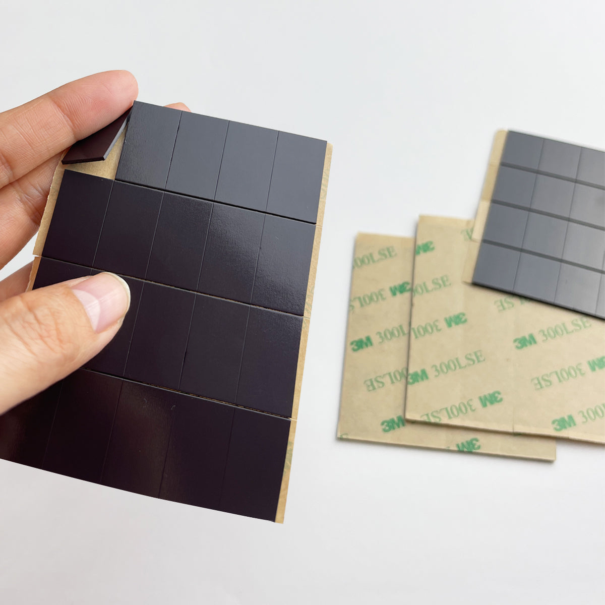 Close-up of adhesive magnet strip – flexible and easy to peel off from backing sheet