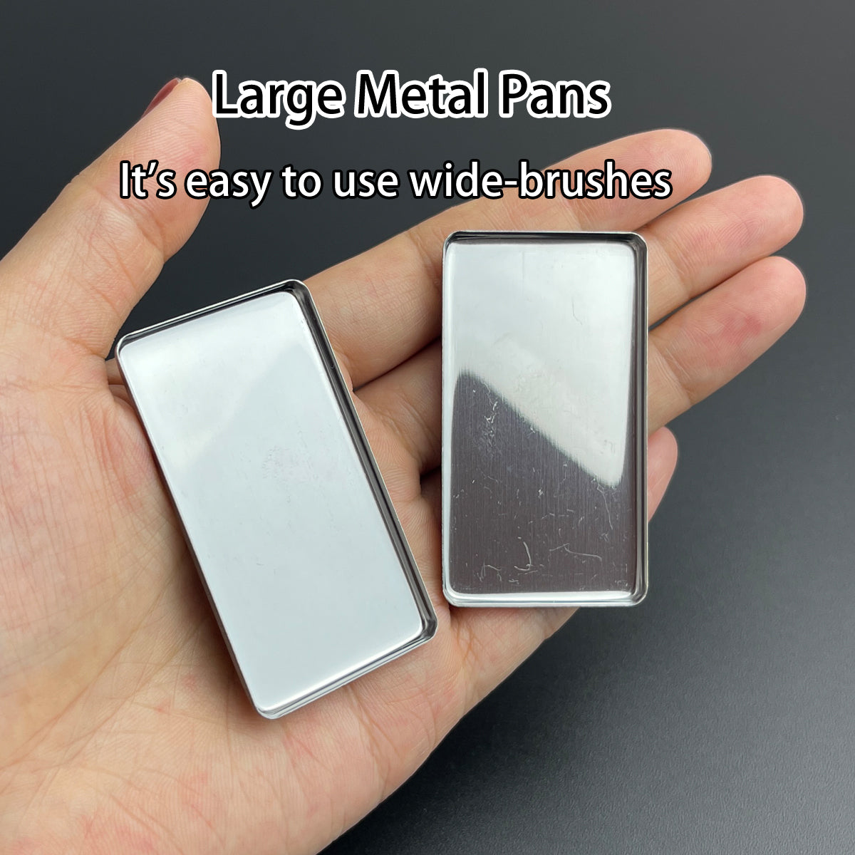 Two large metal pans in hand – easy to use with wide brushes, ideal for watercolor or makeup application