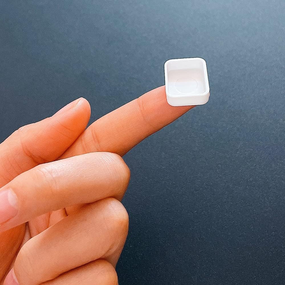 1ml mini watercolor pan shown on fingertip – compact size for sample paints