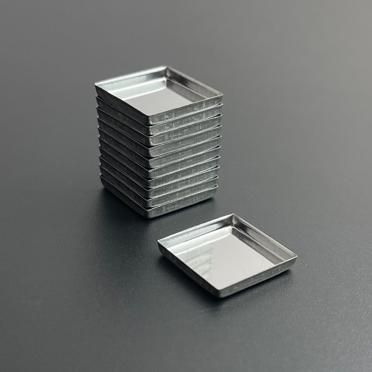 Stacked square metal pans for handmade watercolor, lip color, or eyeshadow – clean and organized storage solution