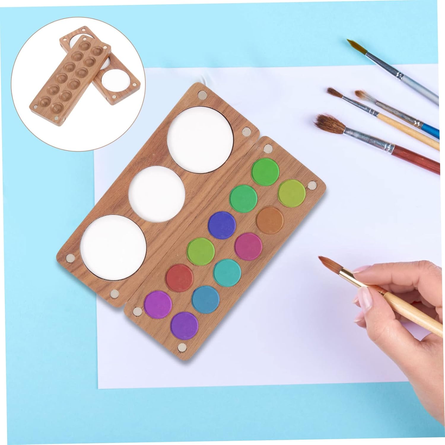 12-round mini watercolor palette filled with favorite paints, perfect for artists on the go.