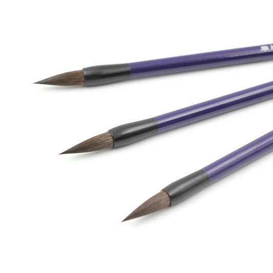 Purple lacquered bamboo brush with decorative gold and silver accents