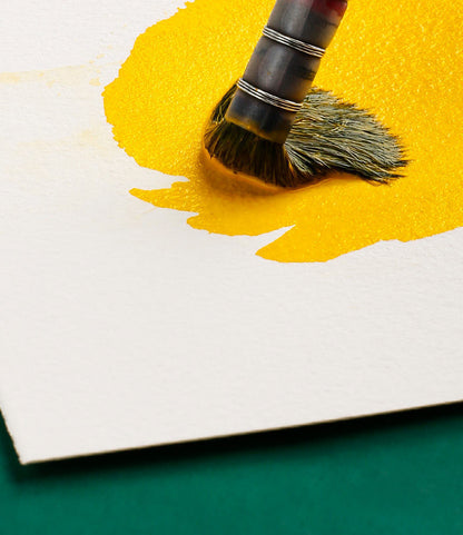 Yellow watercolor paint blending on 100% cotton watercolor paper, demonstrating smooth color diffusion and vibrant results